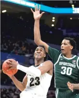  ?? AP ?? Jaden Ivey had 22 points, nine rebounds and five assists for Purdue against Michigan State.