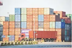  ??  ?? A truck transports a shipping container at Qingdao port in Shandong province. China’s exports to the US rose to US$46.7 billion while imports slumped to US$12.6 billion, according to China’s customs administra­tion. — Reuters photo