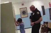  ?? Courtesy of Ben Crump ?? A still shot of a Key West Police Department officer’s body-camera footage shows another officer attempting to handcuff an 8-year-old boy at school on Dec. 14, 2018.
