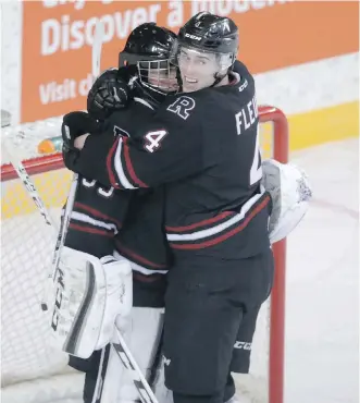  ?? JIM WELLS ?? Red Deer Rebels defenceman Haydn Fleury, hugging goalie Trevor Martin, said he doesn’t expect to see too many blowouts in the Eastern Conference final against the Brandon Wheat Kings.