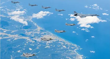  ?? AP ?? A US Air Force B-1B bomber, F-35B stealth fighter jets and South Korean F-15K fighter jets fly over the Korean Peninsula during a joint drill in South Korea.