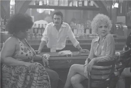  ??  ?? Ruby (Pernell Walker, left), Vincent (James Franco) and Eileen (Maggie Gyllenhaal) are witness to the rise of pornograph­y in the seedy Times Square of the 1970s in “The Deuce.” PAUL SCHIRALDI