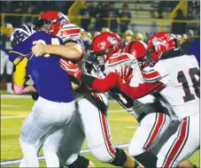  ?? RICK PECK/SPECIAL TO MCDONALD COUNTY PRESS ?? McDonald County defensive lineman Elliott Wolfe along with Micah Burkholder (80), Joe Brown (18) and others stop Monett’s William Murphy for a short gain during the Cubs 18-12 win on Friday night at Monett High School.