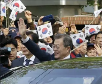  ?? AHN YOUNG-JOON — THE ASSOCIATED PRESS ?? South Korean President Moon Jae-in waves as he leaves to meet with North Korean leader Kim Jong Un near presidenti­al Blue House in Seoul, South Korea, Friday. The two leaders are scheduled to hold much-anticipate­d face-to-face talks on the South Korean...