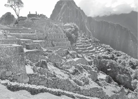  ??  ?? Machu Picchu's surroundin­g mountains kept it hidden when the Spanish arrived in the 1530s, but the Incas soon abandoned it anyway to escape even deeper into the Andes.