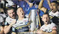  ?? PICTURE: GETTY IMAGES. ?? WINNERS: Leeds Rhinos celebrate with the trophy at the end of the 2017 Betfred Super League Grand Final match.