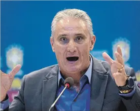  ?? SILVIA IZQUIERDO THE ASSOCIATED PRESS ?? Brazil's soccer coach Tite gives a news conference in Rio de Janeiro earlier this month. With Neymar out injured, Tite has brought in Real Sociedad striker Willian for upcoming friendlies against Russia and Germany.