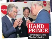  ??  ?? HAND PRINCE Pierce represents Charles’ charity