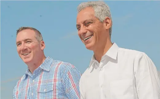  ?? BRIAN JACKSON/FOR THE SUN-TIMES, FILE ?? Park District chief Michael P. Kelly (shown with Mayor Rahm Emanuel in 2015) signed his first Park District contract in December.