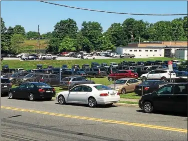  ?? SUBMITTED PHOTO ?? Cars parked along Beech Street and on the property of the former Edgewood School during Big 4 Lacrosse Champions League tournament in June, hosted by The Hill School.