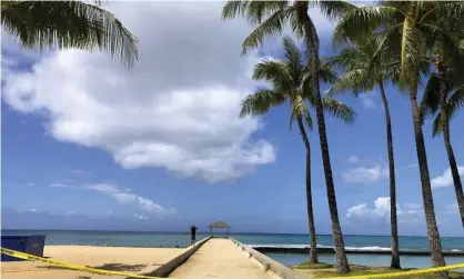  ?? Photograph: Caleb Jones/AP ?? Waikiki Beach in Honolulu. Many locations are increasing­ly vulnerable to elevated high tides and stronger storms fueled by global heating.