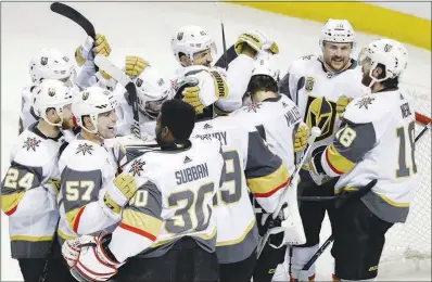  ?? MARCIO JOSE SANCHEZ / AP ?? Vegas Golden Knights players celebrate after a 3-0 win Sunday against the San Jose Sharks in Game 6 of their Stanley Cup playoff series that clinched a berth in the Western Conference finals for the expansion team.