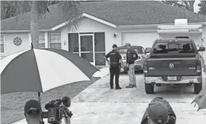  ?? CURT ANDERSON/AP ?? Authoritie­s investigat­e Brian Laundrie’s parents’ home in North Port, Fla., on Monday, in connection with the disappeara­nce of Gabby Petito.