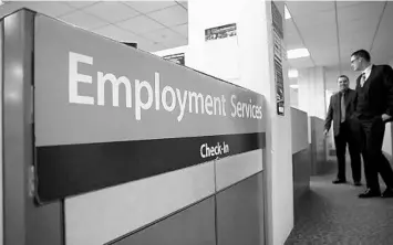  ?? SPENCER PLATT/GETTY IMAGES ?? Unemployme­nt offices have been overwhelme­d by claims from workers who’ve lost jobs due to the new coronaviru­s.