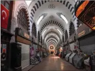  ?? (AFP) ?? View of the deserted iconic Spice Bazaar after a disinfecti­on by Fatih Municipali­ty workers in Istanbul.