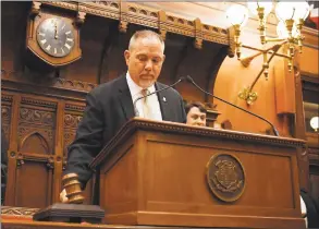  ?? Jessica Hill / Associated Press ?? Speaker of the House Joe Aresimowic­z, D-Berlin, brings down a gavel at midnight Wednesday to end the General Assembly’s regular session at the Capitol in Hartford.