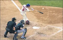  ?? ?? Philadelph­ia Phillies’ Phil Gosselin, right, hits a two-run home run during the sixth inning of a baseball game against the Miami Marlins Saturday in Philadelph­ia.