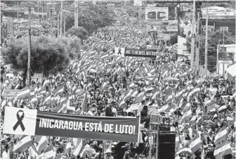  ?? ESTEBAN FELIX AP FILE ?? Hundreds of thousands march against Nicaragua’s President Daniel Ortega in Managua on May 30, 2018. At least 17 people died that day when riot police and Ortega supporters clashed with protesters.