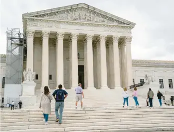  ?? J. SCOTT APPLEWHITE/AP ?? Visitors tour the Supreme Court last Monday in Washington. A new court term begins Monday.