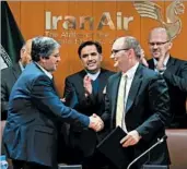  ?? EPA ?? Iran Air chief Farhad Parvaresh, left, and Boeing executive Fletcher Barkdull finalize a deal Sunday on 80 aircraft.