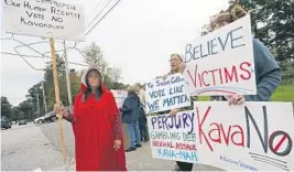  ?? ELISE AMENDOLA/AP ?? Activists protest Friday at Saint Anselm College in Manchester, N.H.