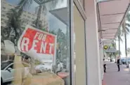  ?? AP PHOTO/LYNNE SLADKY ?? A For Rent sign hangs on a closed shop during the coronaviru­s pandemic in Miami Beach, Fla., on July 13.