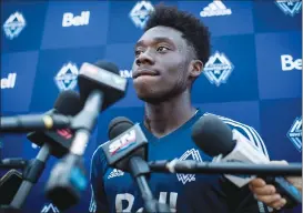  ?? Canadian Press photo ?? Vancouver Whitecaps midfielder Alphonso Davies listens during a news conference at the MLS soccer team’s training facility in Vancouver last week.