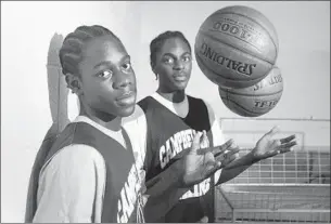  ?? Robert Lachman Los Angeles Times ?? CAMPBELL HALL once had Jrue, left, and Justin Holiday on the same basketball team. Now they play for NBA teams, along with younger brother Aaron.