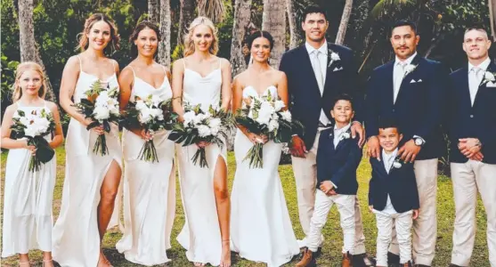  ?? ?? Cowboys player Jordan Mclean and wife Brianna, with their bridal party at their wedding.