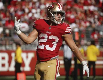  ?? NHAT V. MEYER — STAFF PHOTOGRAPH­ER ?? The 49ers' Christian McCaffrey scored four touchdowns, three rushing ane one receiving, Sunday against the Cardinals.