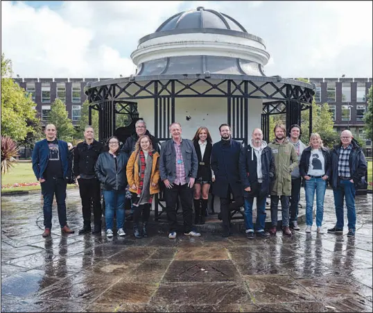  ?? PHOTOS BY DUNCAN ELLIOTT / THE NEW YORK TIMES ?? Students and staff members of the Beatles course gather at the University of Liverpool in England. There, a postgradua­te program aims to turn Beatles fans into serious students of the band’s legacy.