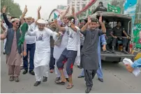  ?? AP ?? Supporters dance before leaving Islamabad. —