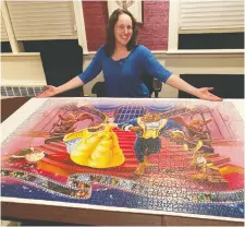  ?? MALKa BENJAMIN ?? Malka Benjamin completed the Beauty and the Beast section of a giant collaborat­ive puzzle consisting of 40,320 pieces.