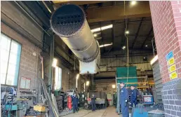  ??  ?? Shortly after its arrival at Bridgnorth’s boiler works, 4930’s overhauled boiler has been lifted from the road lorry. (SVR)