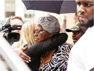  ??  ?? Audrey, mother of victim Samuel DuBose, hugs a supporter in Cincinnati, Ohio, on Friday. (Reuters)
