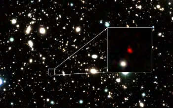  ?? Harikane et al, via © The New York Times Co. ?? HD1, a reddish blob that appears to be the earliest and most distant galaxy ever seen.