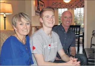  ?? JUANITA MERCER/THE TELEGRAM ?? Aaron with his parents at home in Paradise. From left: Carolyn Coady, Aaron Coady, and Paul Coady.