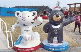  ??  ?? Photo shows the mascots of the 2018 Winter Olympics, which will be held in Pyeonchang in February.
