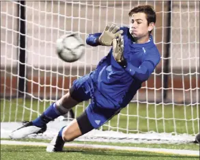  ?? Arnold Gold / Hearst Connecticu­t Media ?? Guilford goalie Justin Hess blocks a penalty shot in the second half of the SCC Championsh­ip in Madison against Daniel Hand on Nov. 12.