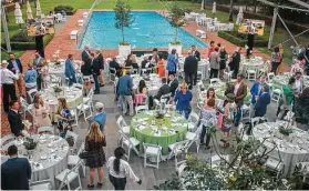  ?? Photos by Gary Fountain / Contributo­r ?? Trees for Houston supporters attend the Root Ball. Others did so virtually.