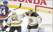  ?? JASON DECROW / AP ?? Islanders’ Jean-Gabriel Pageau scores past Bruins’ Tuukka Rask in the third period on Monday night in Uniondale, N.Y.