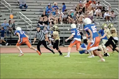  ?? Tim Godbee ?? Calhoun sophomore running back Jacquin McClarty looks for running room outside during the second half of the Jackets’ easy scrimmage win over Northwest Whitfield County