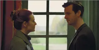  ?? VERTICAL ENTERTAINM­ENT ?? Maggie (Cara Theobold) and Bernard (Gethin Anthony) are drawn to each other in the clever, unusual romance “Around the Sun.”