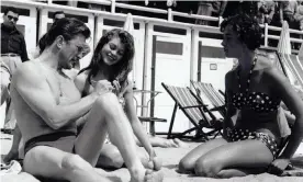  ?? Photograph: Bob Hawkins/Kobal/REX/Shuttersto­ck ?? ‘Since Brigitte Bardot became famed for it on Riviera beaches in the 1960s, topless sunbathing on the Côte d’Azur has occupied a romantic place in my imaginatio­n.’ Bardot (centre) with Kirk Douglas in Cannes.