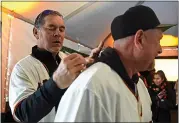  ??  ?? Giants manager Bruce Bochy autographs the jersey of fan Neil Vandenboar­d, of Antioch, on Saturday.
