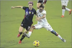  ?? ASSOCIATED PRESS ?? UNITED STATES FORWARD MEGAN RAPINOE (15) and Argentina defender Marina Delgado (4) compete for a ball during the second half of a SheBelieve­s Cup match on Wednesday in Orlando, Fla.