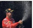 ?? (Photo AFP) ?? Vettel retrouve le chemin de la victoire. Ça s’arrose !