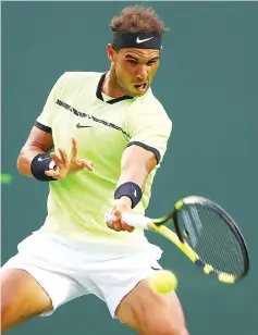  ??  ?? Rafael Nadal of Spain reterns a shot against Dudi Sela of Israel during day 5 of the Miami Open at Crandon Park Tennis Center in Key Biscayne, Florida. - AFP photo