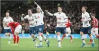  ??  ?? Tottenham players celebrate scoring against Middlesbro­ugh on Tuesday.