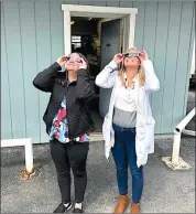  ?? Photo submitted ?? Housler Family Eye Care staff Michelle Brooks and Dr. Krystal Fordoski made sure to use proper eye protection while viewing the solar eclipse on Monday.